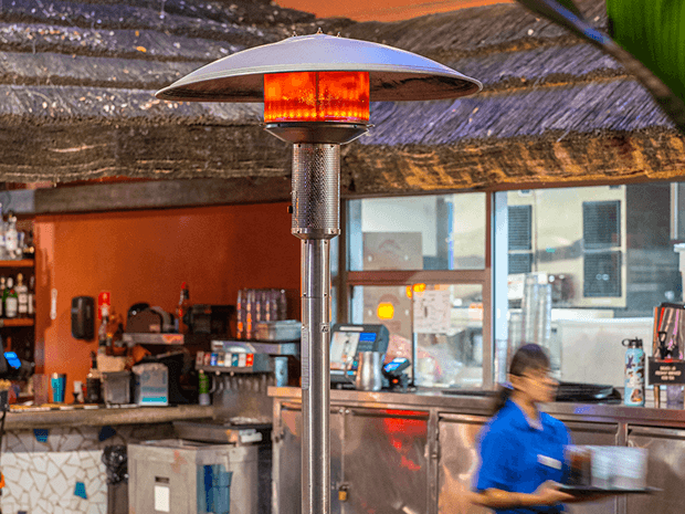 portable mushroom heater in an outdoor kitchen